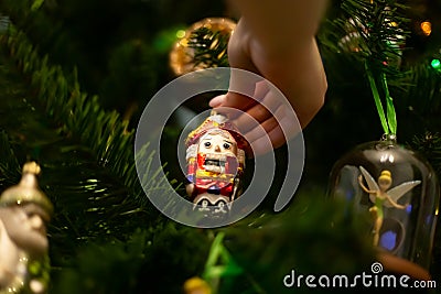 Merry Christmas. Winter holidays preparation. Beautiful Christmas tree decorations with Disney characters Milan, Italy Editorial Stock Photo