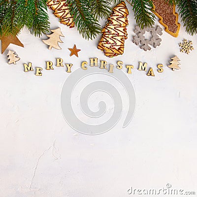 Merry Christmas written with wooden letters, cookies and Christmas decorations Stock Photo