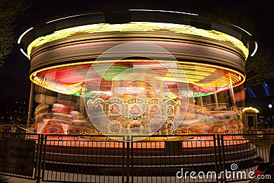 Merry go round, carousel, in motion at night Stock Photo