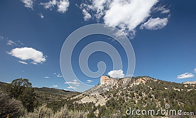 Mesa butte under blue sky in Little Book Cliffs National Monument near Grand Junction Colorado United States Stock Photo