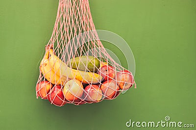 Mesh bag of fruits Stock Photo