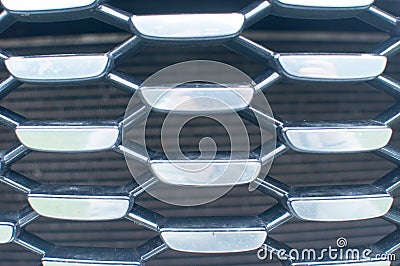 Mesh machine. Radiator grille. Metal texture. the radiator grill is large powerful. The front of the car. Truck radiator grill. Stock Photo