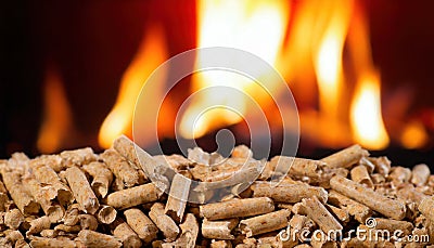 wood pellets in front of flames Stock Photo