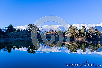 Mesmerizing reflection of Garhwal Himalayas in Deoria Tal or Lake. Stock Photo