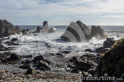 Mesmerizing seascape with waves crashing on the rocks Stock Photo