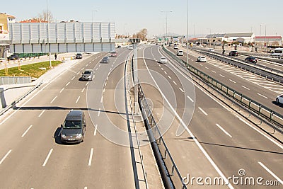 Mesmerizing shot of a long road with a lot of automobiles on a sunny day Editorial Stock Photo