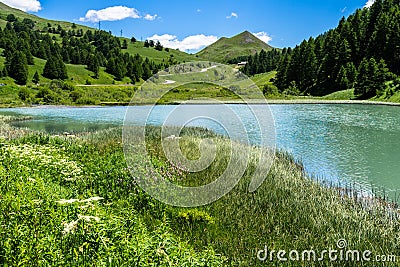 Mesmerizing shot of a small alpine lake near Col de Vars in French Alps Stock Photo