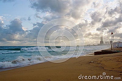 Mesmerizing view of a beautiful sandy beach with cloudscape in the background Stock Photo