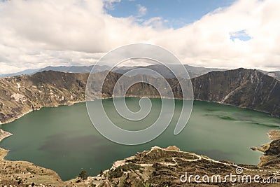 Mesmerizing view of Laguna Quilotoa in Quinta, Ecuador with a cloudy sky background Stock Photo