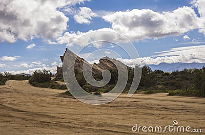 Mesmerizing view of the rock in a desert under the blue sky Stock Photo