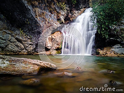 Mesmerizing waterfall amid Dehradun's jungles, Shikhar Fall tourist spot. Silky cascading water captured in a stunning long- Stock Photo