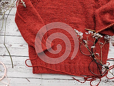 Knitter`s table, morning coffee and unfinished knitting project Stock Photo