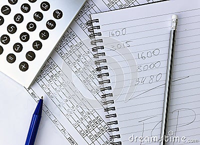 Mess on your desktop. Calculator, notebook, documents Stock Photo