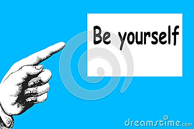 `Be Yourself`. The direction of the finger points to a motivational and inspirational message. Stock Photo