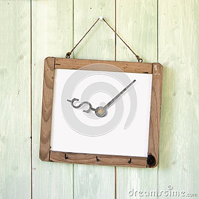 Message board of dollar sign clock hanging on wooden wall Stock Photo
