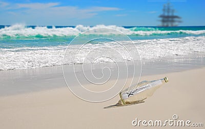 Message in Bottle on Beach Stock Photo