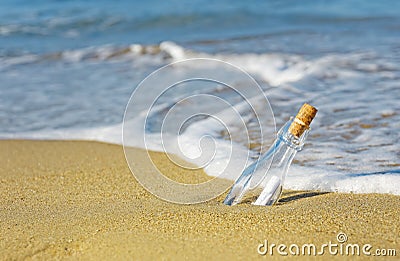 Message in a Bottle on beach sea Stock Photo