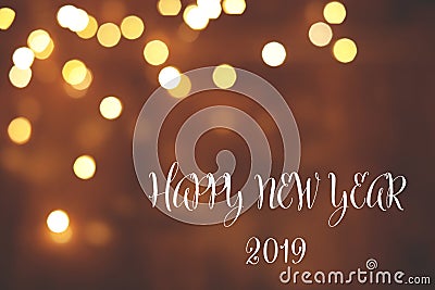 Message HAPPY NEW YEAR 2019 and bokeh effect on background, space for text. Stock Photo