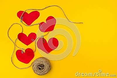 The message on the rope for mom from a small child. A lot of hearts on a yellow background Stock Photo