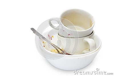 Messthetics aesthetic concept. A photo of dirty empty ceramic cups, bowls, two spoons and a plate isolated on white background. Di Stock Photo