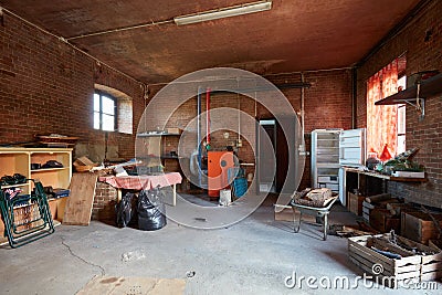 Messy basement with red bricks walls in old country house Stock Photo