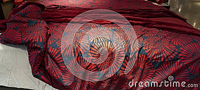 Messy bed concept. RED themed bed sheets and pillows messed up after nights sleep Stock Photo
