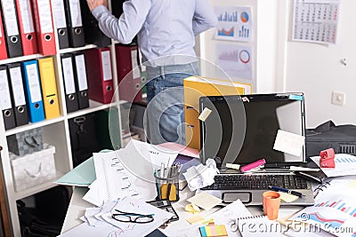 Messy and cluttered desk Stock Photo