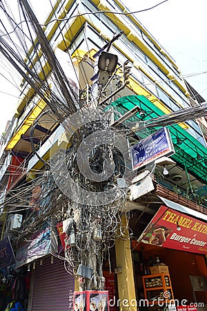 Messy electrical wiring over a post, Kathmandu, Nepal Editorial Stock Photo