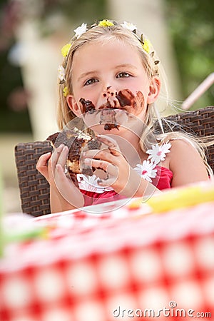 Messy Girl Eating Chocolate Cake Stock Photo