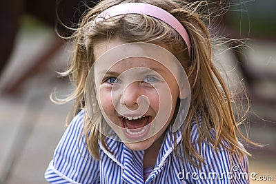 Messy Girl Laughing Stock Photo