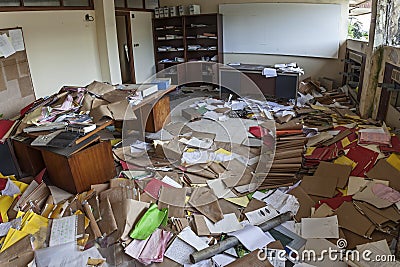 MESSY OFFICE FULL OF FOLDERS AND PAPERS Stock Photo