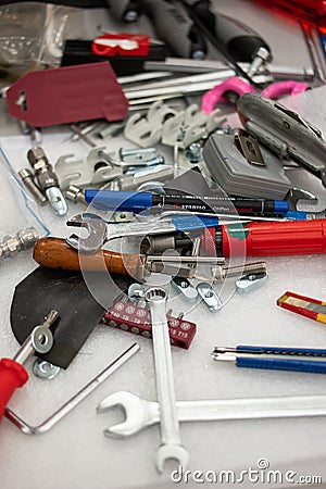 Messy tool desk top view scattered and unorganized work tools no people Stock Photo