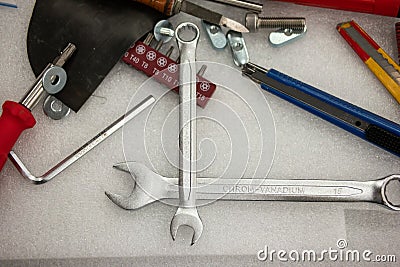 Messy tool desk top view scattered and unorganized work tools no people Stock Photo