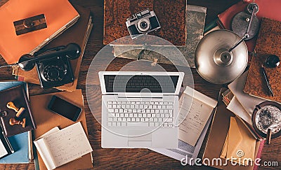 Messy vintage desktop with laptop Stock Photo