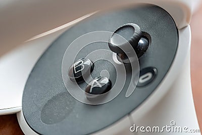 Meta Quest 2 VR headset controller controls object macro, extreme closeup detail. A B and Oculus buttons, analog stick and Editorial Stock Photo