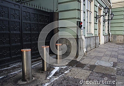 Metal automatic gates with traffic lights and automatic parking posts Stock Photo