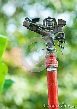 Metal automatic water sprinkler Stock Photo