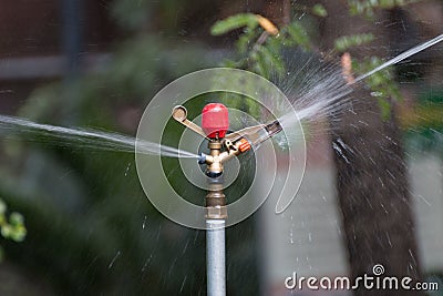 Metal automatic water sprinkler Stock Photo