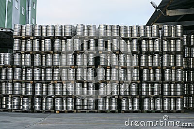 Metal barrels full of beer stacked in the yard of beer plant Obolon to deliver for sale. Editorial Stock Photo