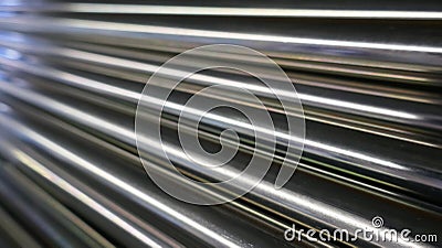 Metal bars, chrome plated and glossy, arranged diagonally Stock Photo