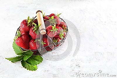 Metal basket with fresh strawberries. Natural product. Copy of the space. Food for vegetarians. Flat layout.Top view Stock Photo