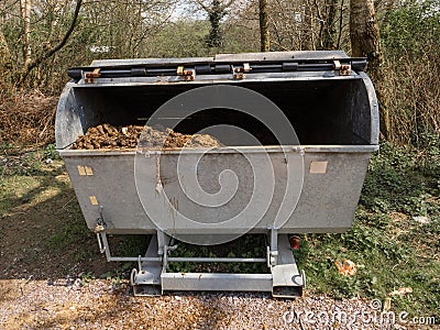Metal bin full of horse excrement's in a park. Collection from tour carriers which carry tourist around. Natural organic Stock Photo