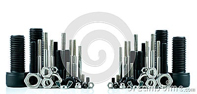 Metal bolts and nuts on white background. Fasteners equipment. Hardware tools. Stud bolt, hex nuts, and hex head bolts in workshop Stock Photo