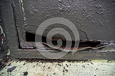 The metal box with a hole cut out and corrosion Stock Photo