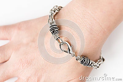 Metal bracelet on the female wrist Stock Photo