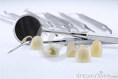 Metal ceramic dentures with dentist tools Stock Photo