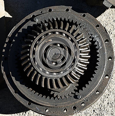 Metal cog gears joining together from tractor Stock Photo