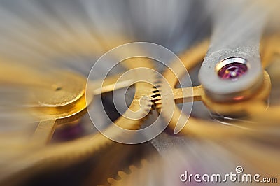 Metal Cogwheels in clock mechanism , abstract sun beams, Concept Movement is life, Teamwork , Idea Technology, Infinity. Macro Stock Photo