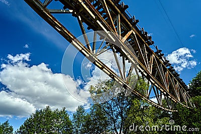 Metal construction of a destroyed railway viaduct Stock Photo