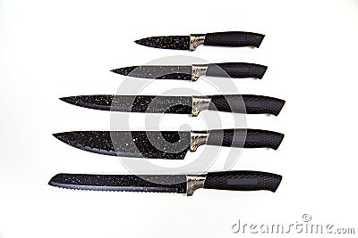 Metal cooking peeler knives with antibacterial coating black handle isolated on white background. Kitchen utensils, edged weapons Stock Photo